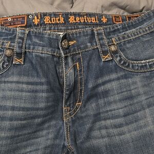 Rock Revival Slim Blue Jeans with Natural Wear Patterns